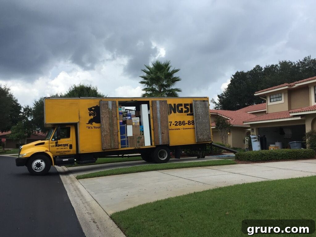 Moving truck parked outside a new house, symbolizing a fresh start and the exciting journey of relocation