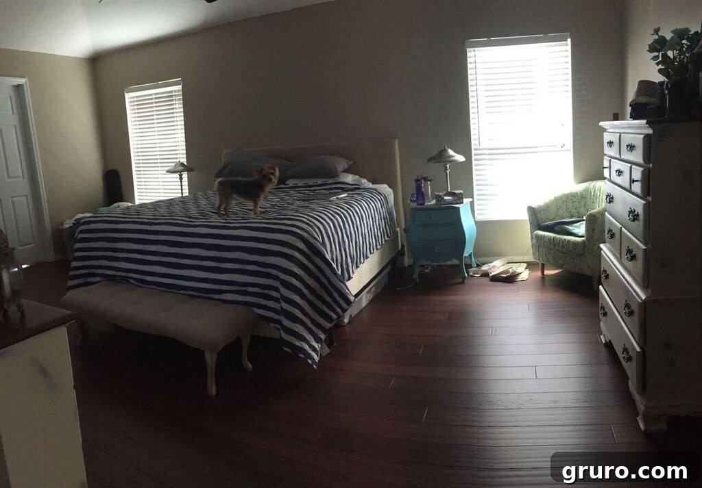 Serene master bedroom in a new home, partially unpacked, with a comfortable bed and natural light