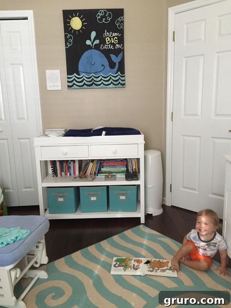 Charming whale-themed nursery with a crib and wall art, ready for a toddler's dreams