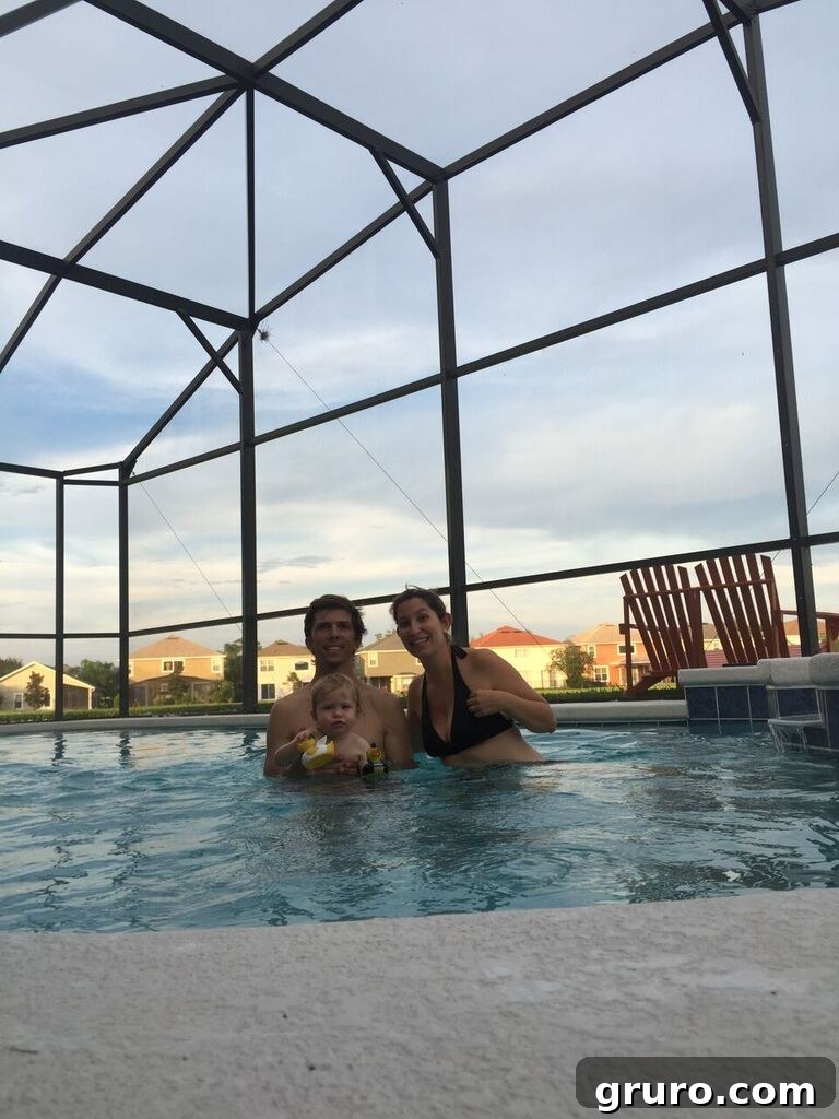 Family enjoying their first swim in the new pool, celebrating new memories and relaxation