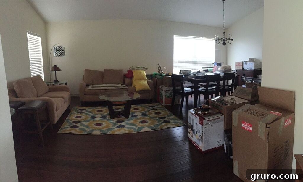 Cozy entryway of a new home with personal touches and unpacked boxes, showing real life settling in