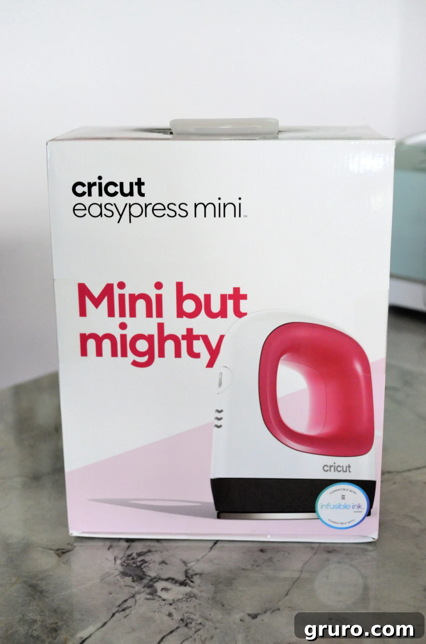 The charming Cricut EasyPress Mini in a beautiful raspberry color, ready for small heat transfer projects.