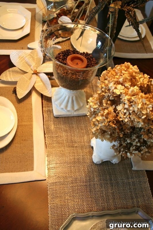 Close-up of a place setting featuring a book page flower, coffee beans, and dried hydrangeas.