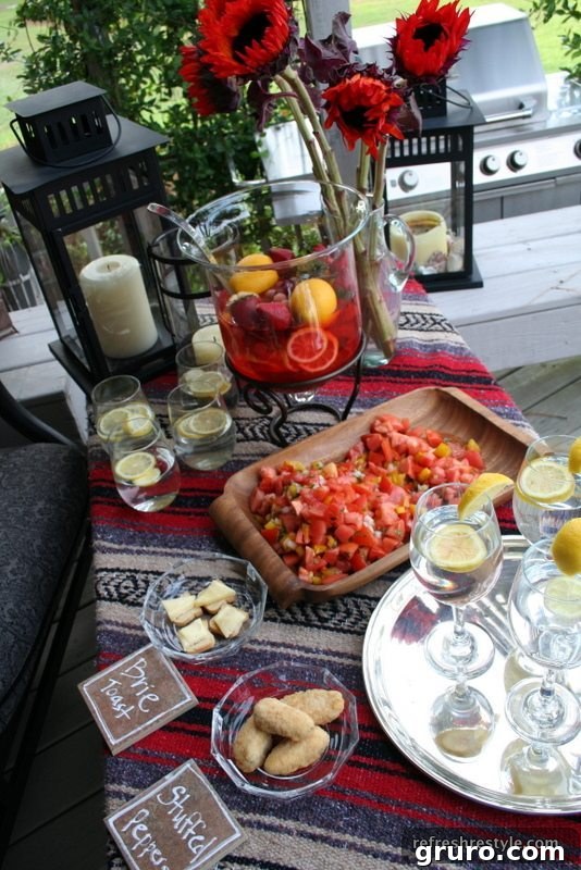A holiday table featuring a cozy blanket as a tablecloth and repurposed tiles serving as elegant food markers.