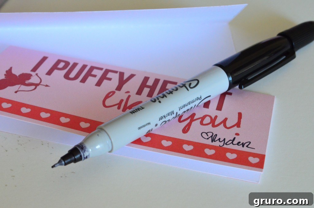 Folding the printable Valentine and signing a message