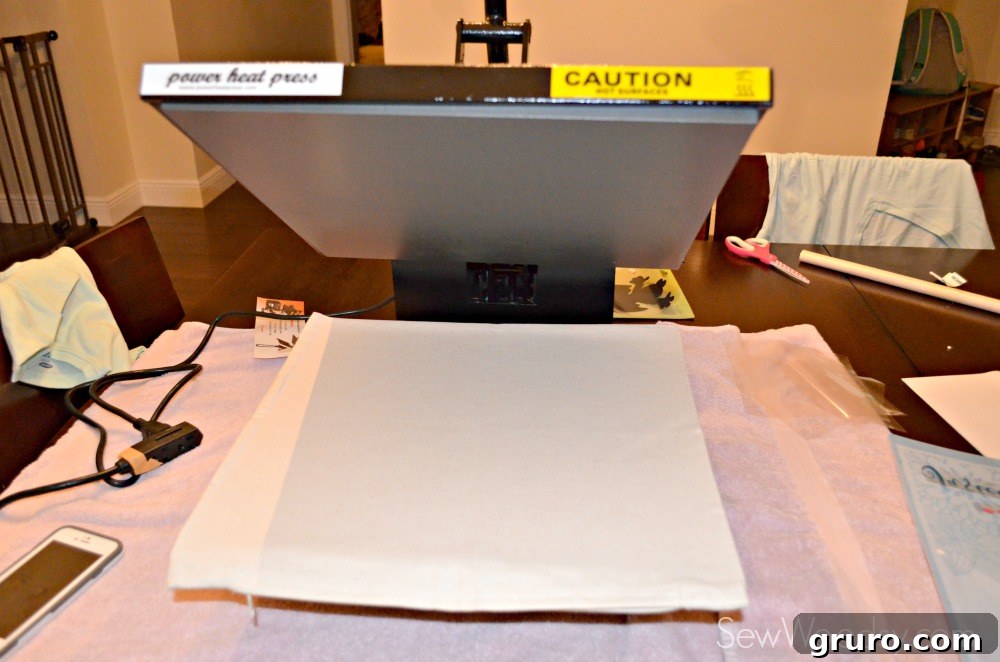 Pre-heating a blank pillow cover with a heat press for vinyl application