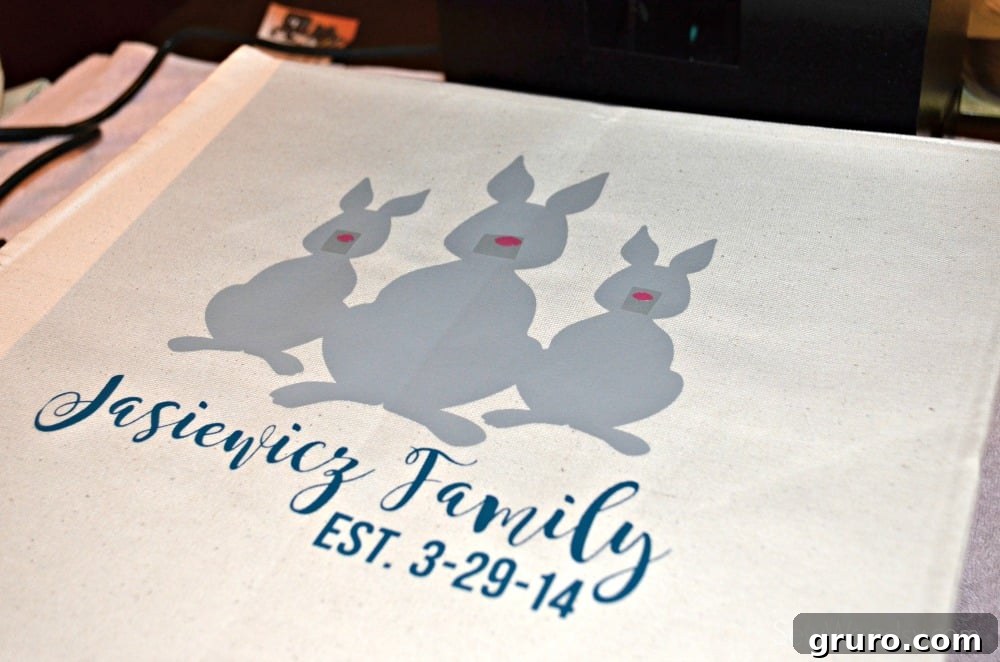 Peeling the clear carrier sheet after pressing main design elements