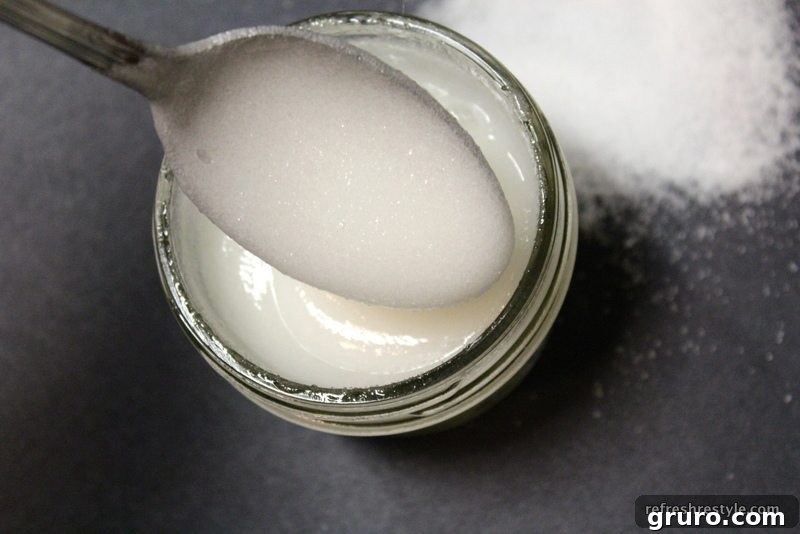Stirring Dawn with Olay into granulated sugar to create a homemade scrub