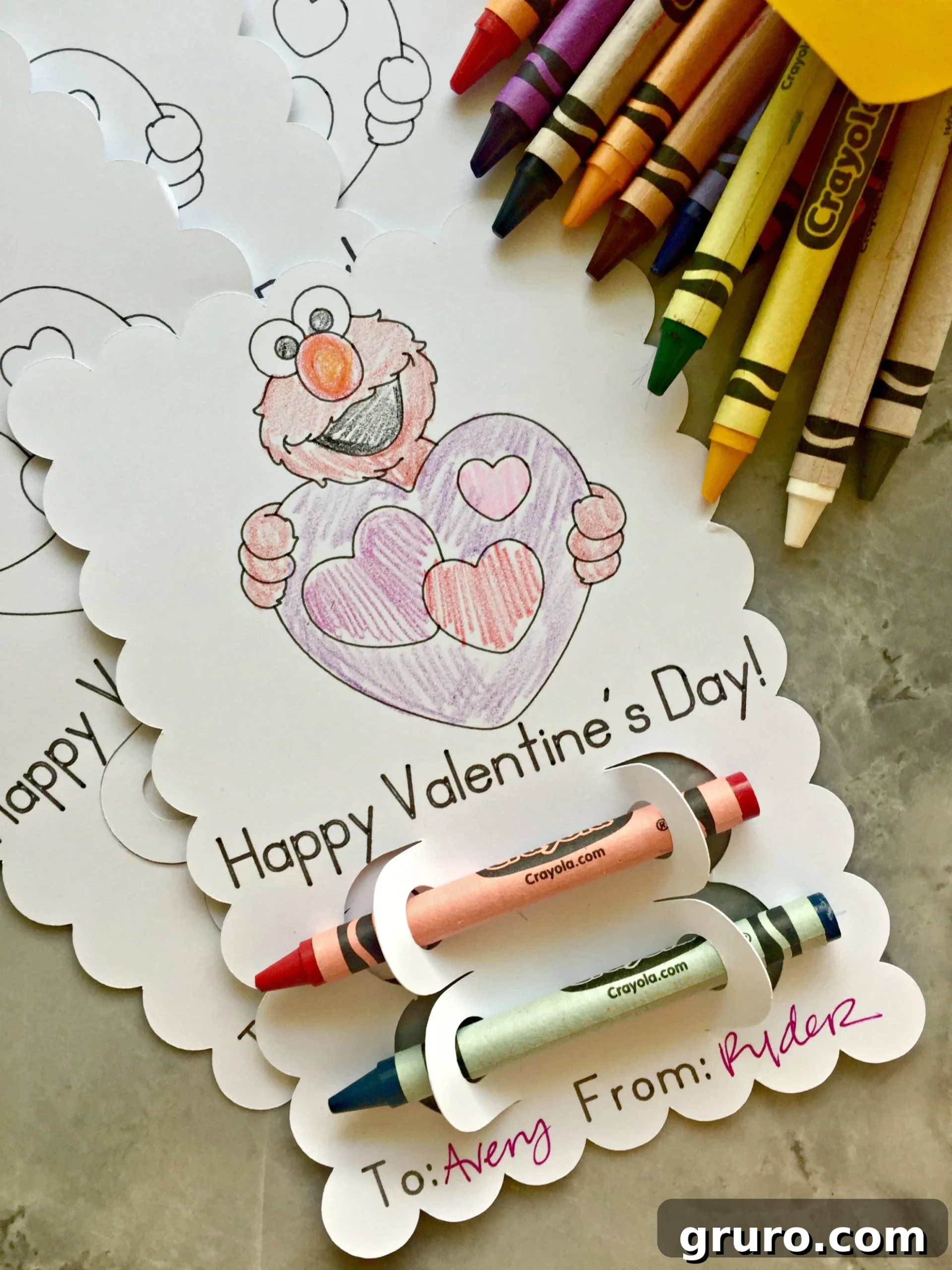 Elmo's Heartfelt Valentine 5 A close-up, top-down view of a single completed Elmo coloring Valentine, highlighting the intricate drawn details and scalloped edge.