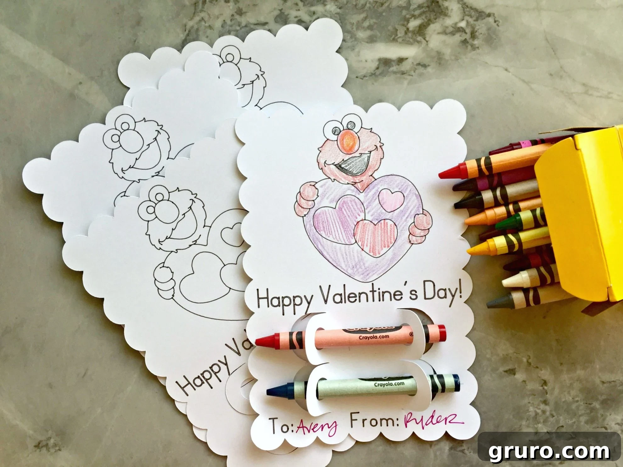 Elmo's Heartfelt Valentine 7 A vibrant display of multiple Elmo coloring Valentines, some already colored in with crayons, showcasing the finished product's appeal.