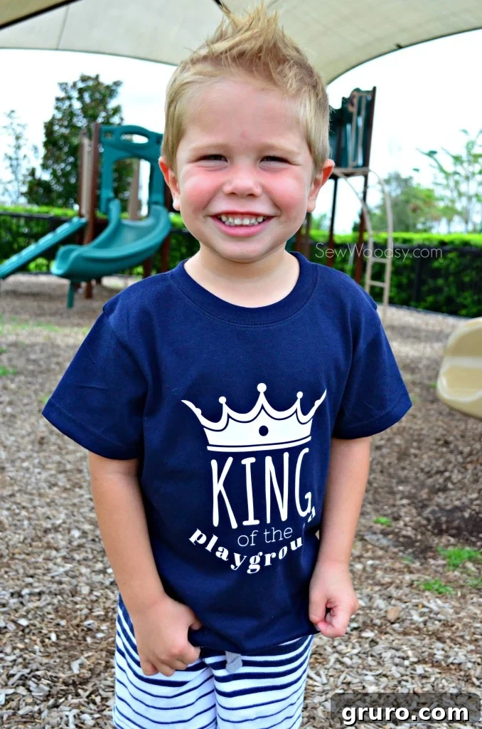 Toddler proudly wearing King of the Playground T-shirt