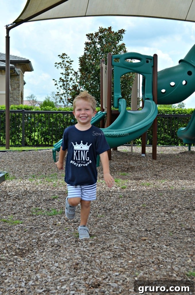 Kid running on the playground in his custom T-shirt