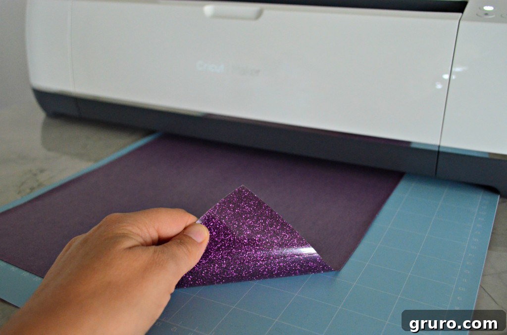 Hand Over The Candy, Witch Pillow 6 Placing Cricut Glitter Iron-On Vinyl onto the mat for the Halloween pillow project