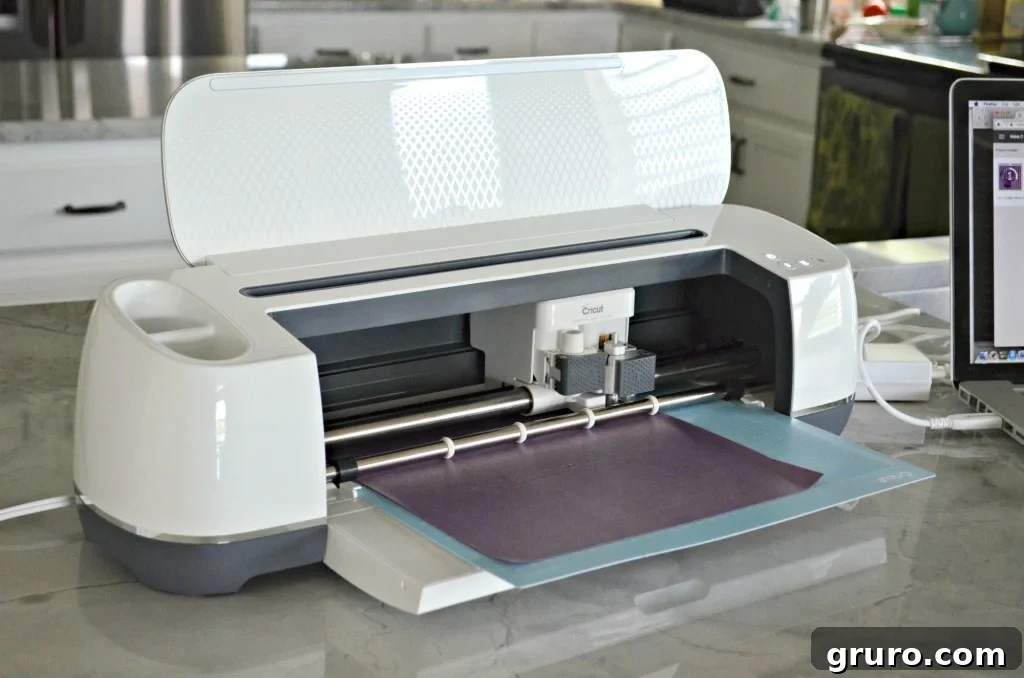 Hand Over The Candy, Witch Pillow 7 Cricut Maker precisely cutting the 'Witch Better Have My Candy' design from Glitter Iron-On Vinyl