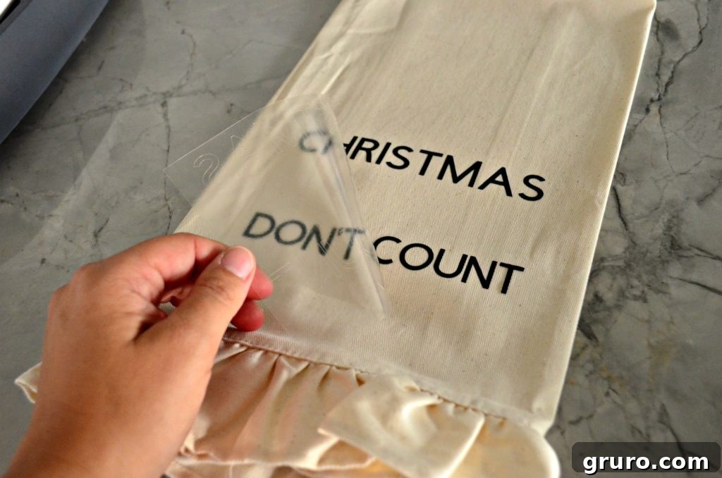 First layer of Iron-On Vinyl applied to the Christmas dish towel
