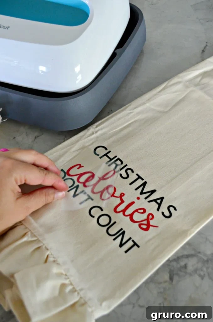 Second layer of Iron-On Vinyl applied to the Christmas dish towel