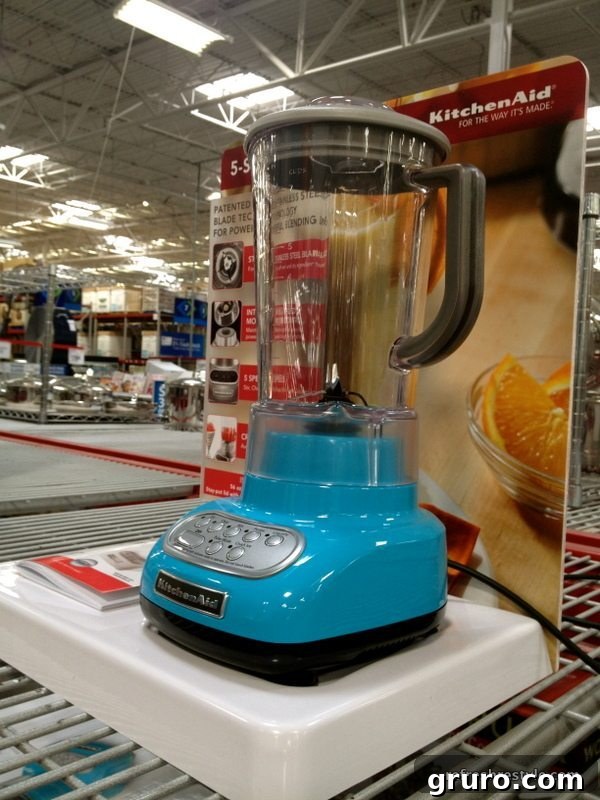 Close-up of a turquoise Kitchen Aid-style stand mixer, showcasing its vibrant color and sleek design