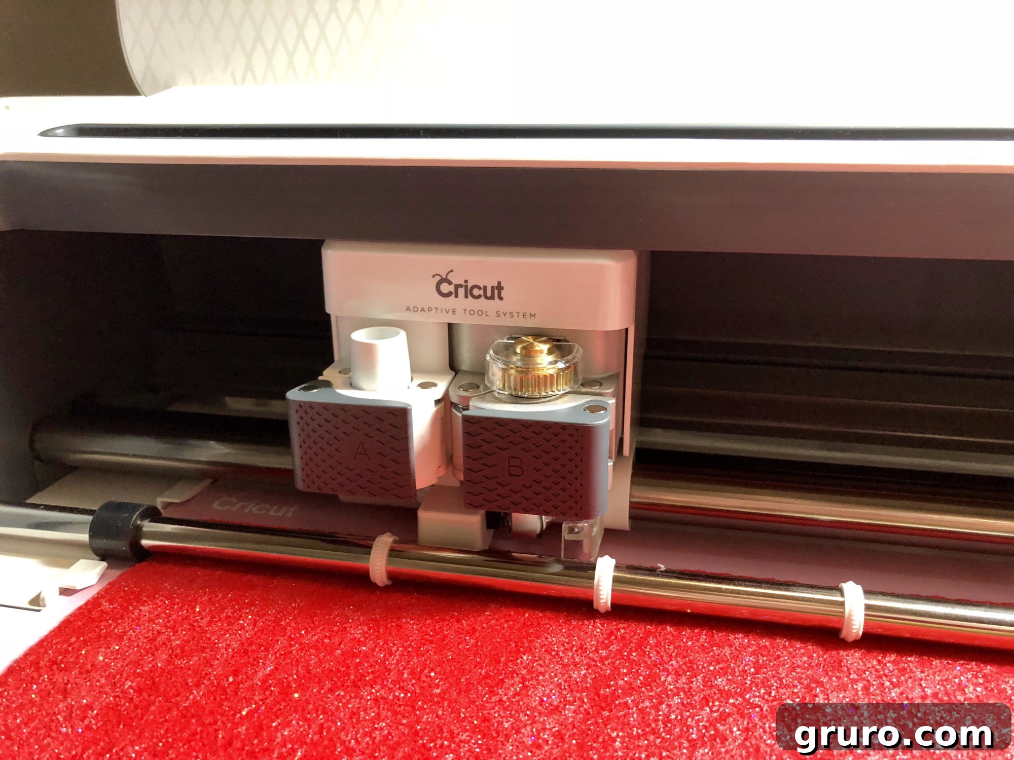 Cricut Maker precisely cutting bonded glitter felt with the rotary blade