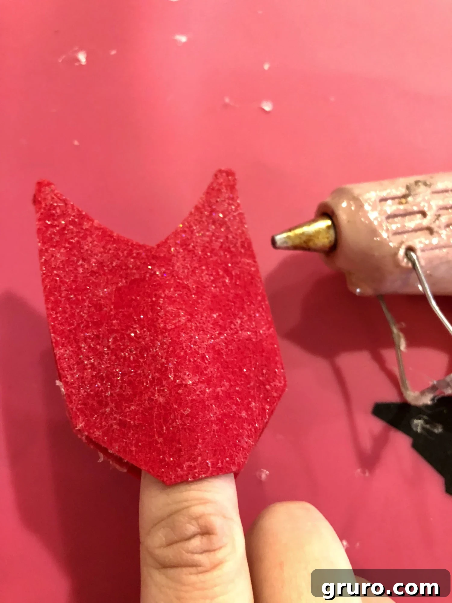 Stretching the felt arrow fletching opening for pencil insertion
