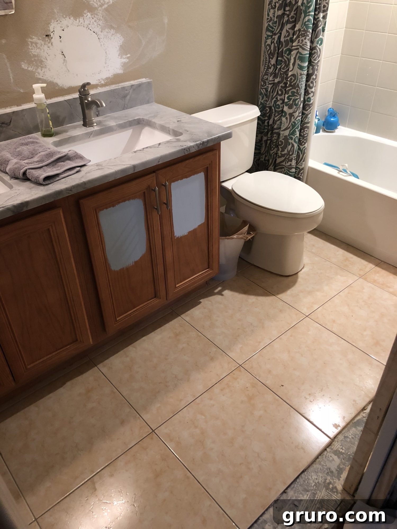 Old guest bathroom before demolition showing outdated tiles and fixtures