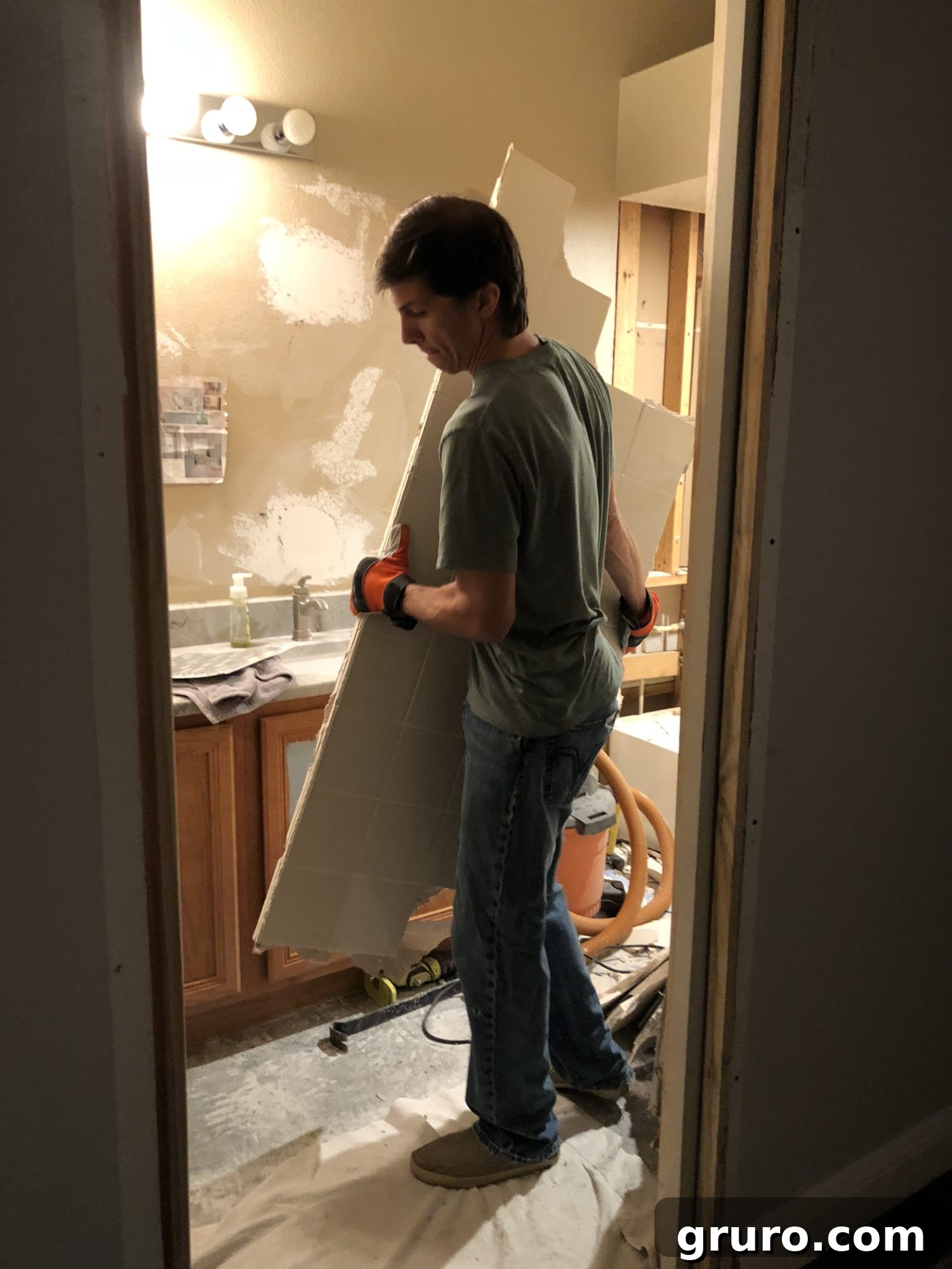 Carrying out heavy pieces of demolished bathroom material