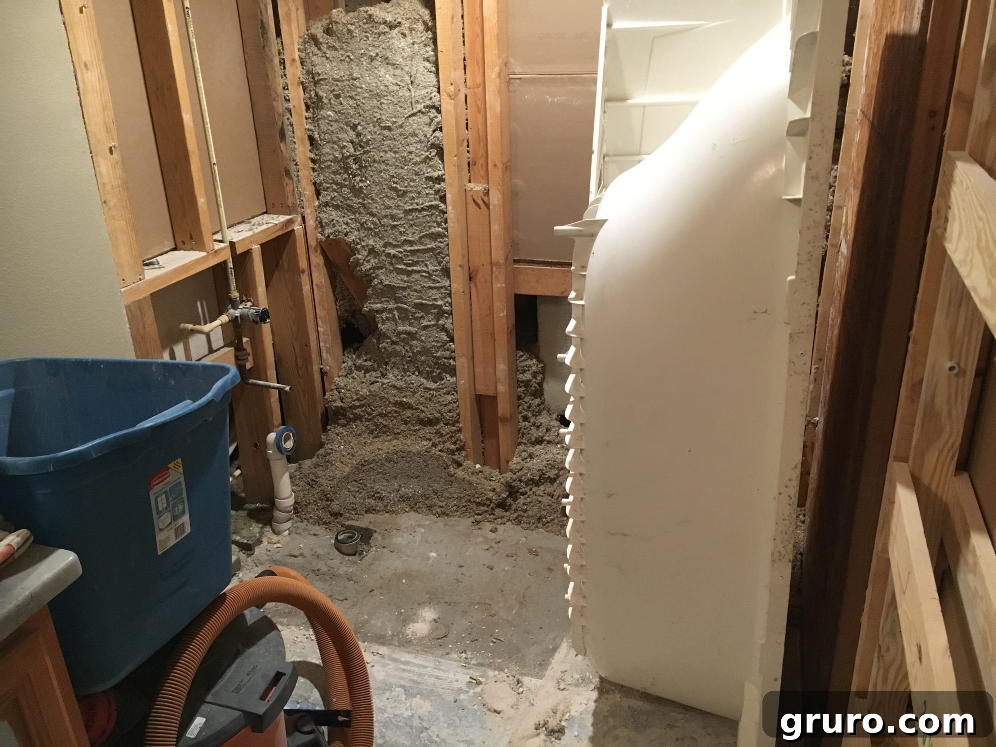 Bathtub removed, leaving a completely empty bathroom space