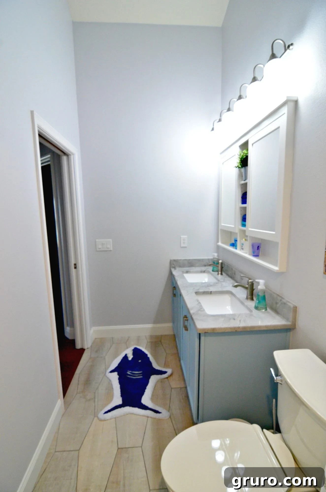 Contemporary Hexagon Floor and Custom Shower Tile in Renovated Bathroom