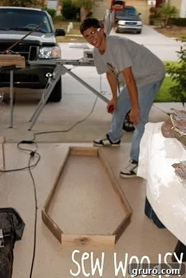 Mr. Woodsy cutting a piece of reclaimed wood for the coffin project.