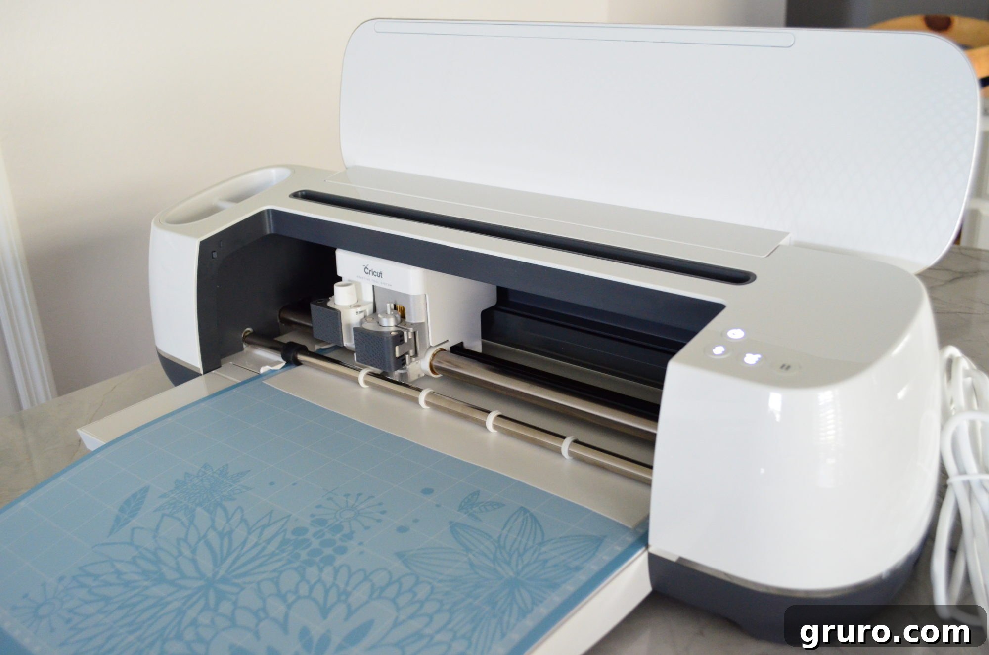 Cricut Maker cutting white vinyl for the Alien eyes