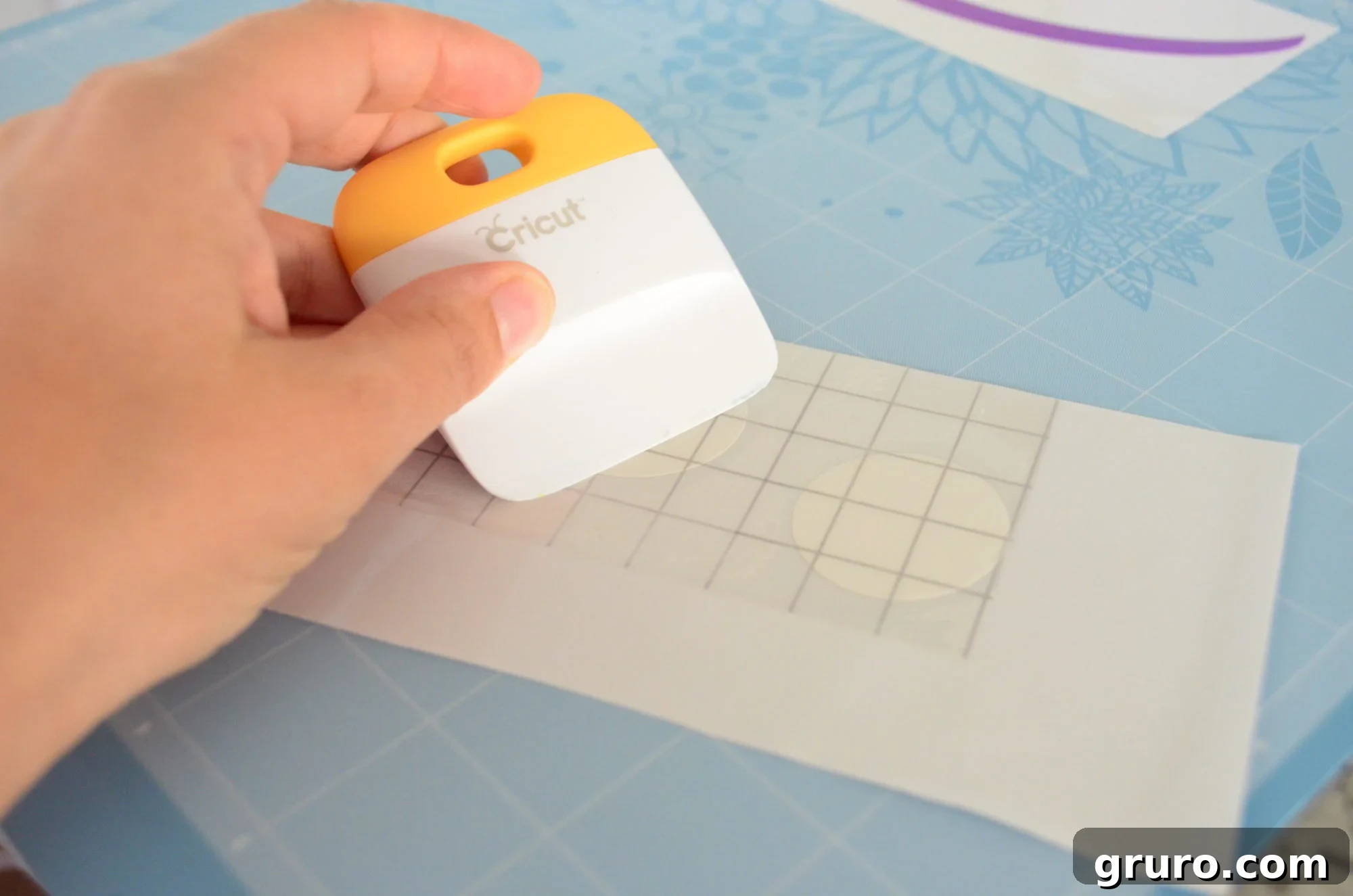 Applying transfer tape to the white vinyl eye circles