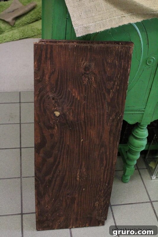 Sturdy salvaged boards for creating rustic ladder shelves