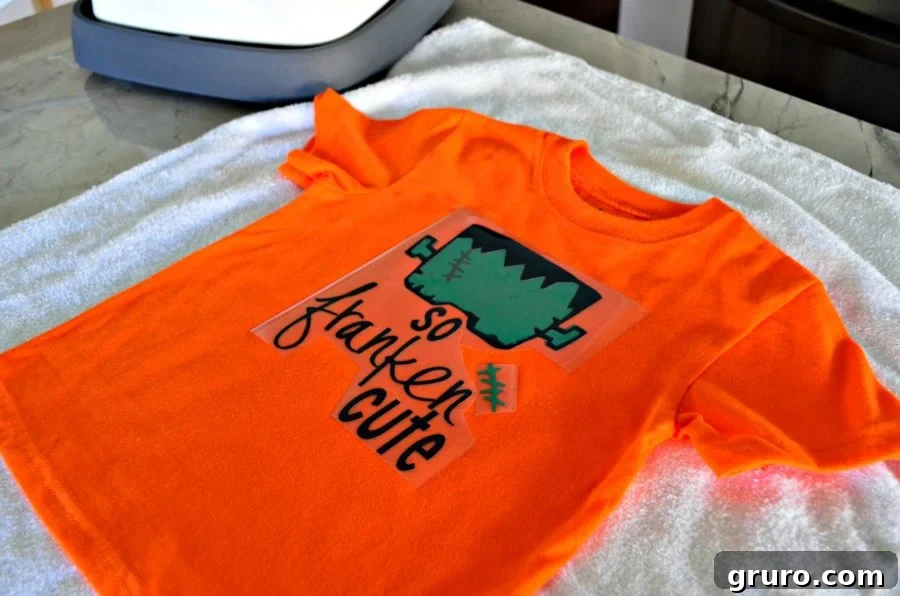 Third and final layer of the 'So Franken Cute' black details and stitches being placed on the t-shirt