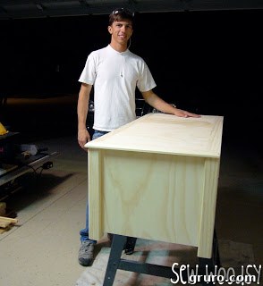 Jon, the skilled handyman and woodworking enthusiast, proudly showing his work.