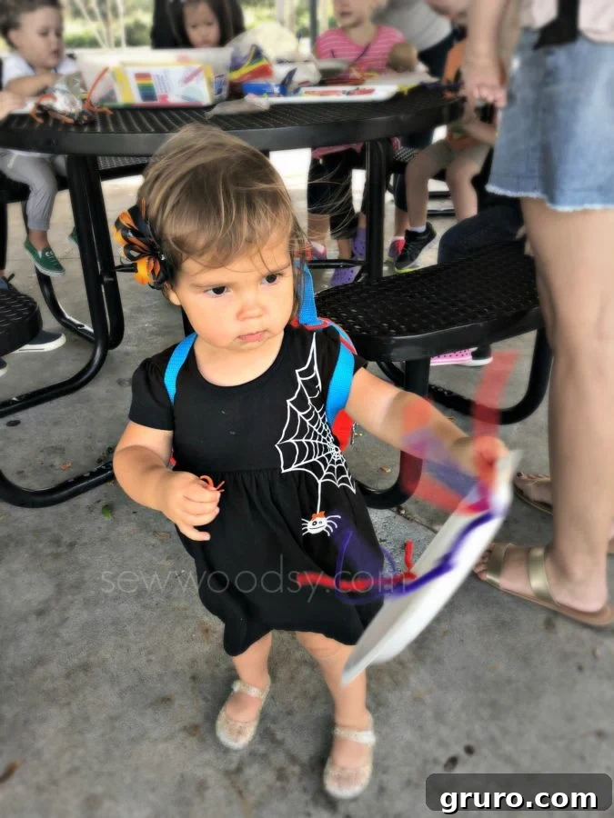 Toddler Girls DIY Spider Web Dress being worn at the park
