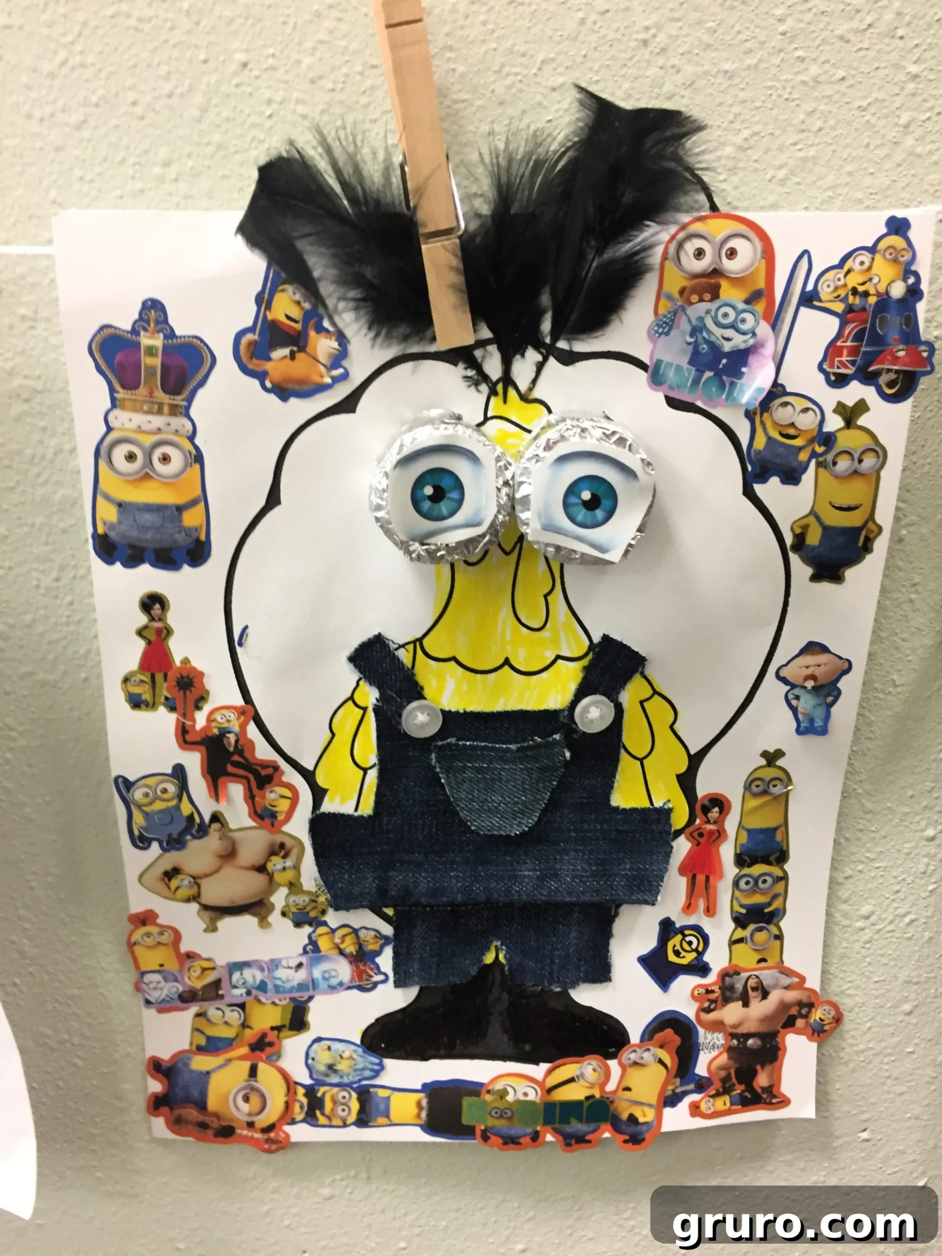 Paper Turkey In Disguise as a Minion with big aluminum foil eyes and minion stickers all over.