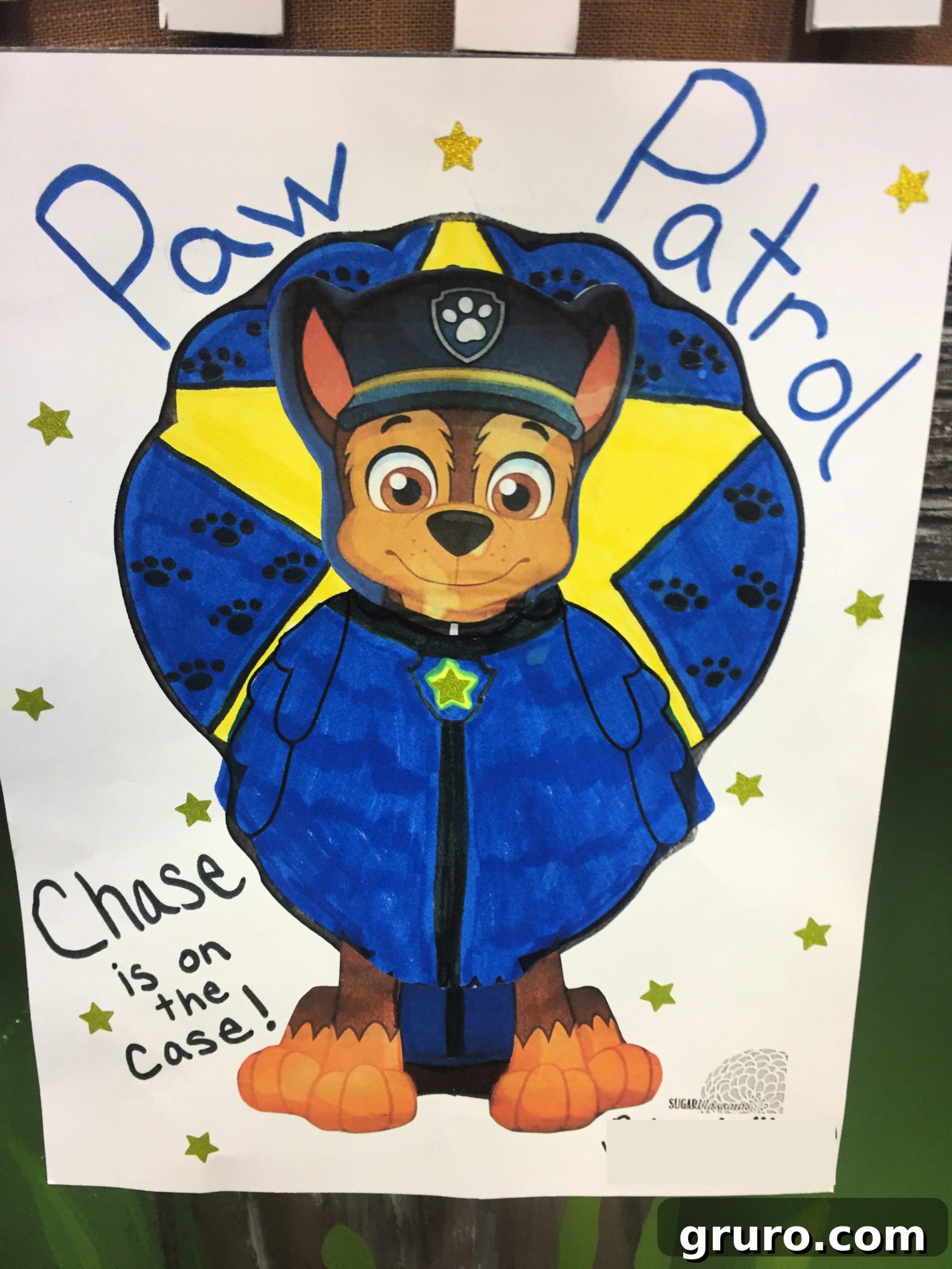 Chase from Paw Patrol dressed as a Turkey In Disguise with the words "paw patrol" written on top.