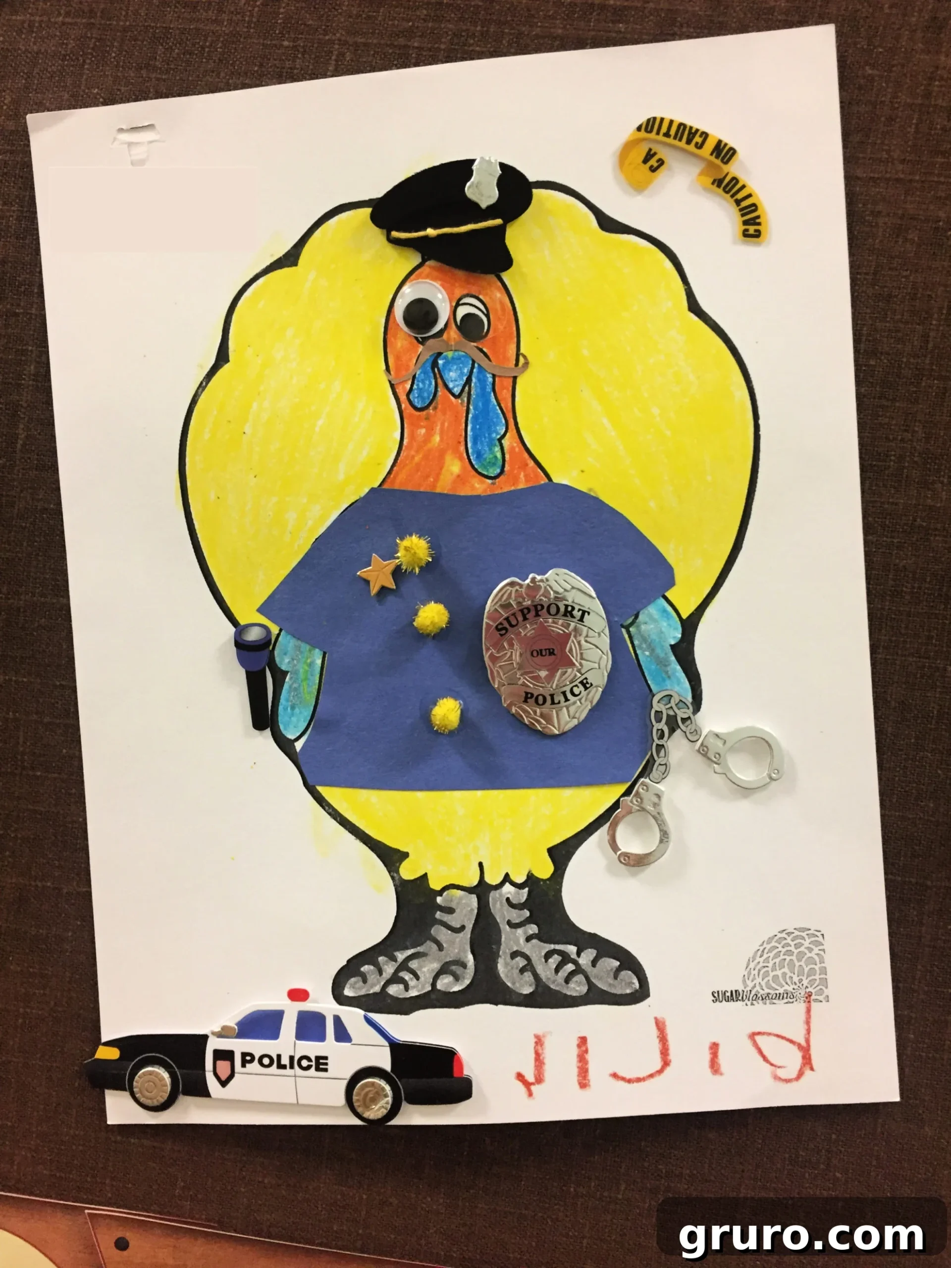Colored paper of a Turkey In Disguise Police Officer with real police badge.