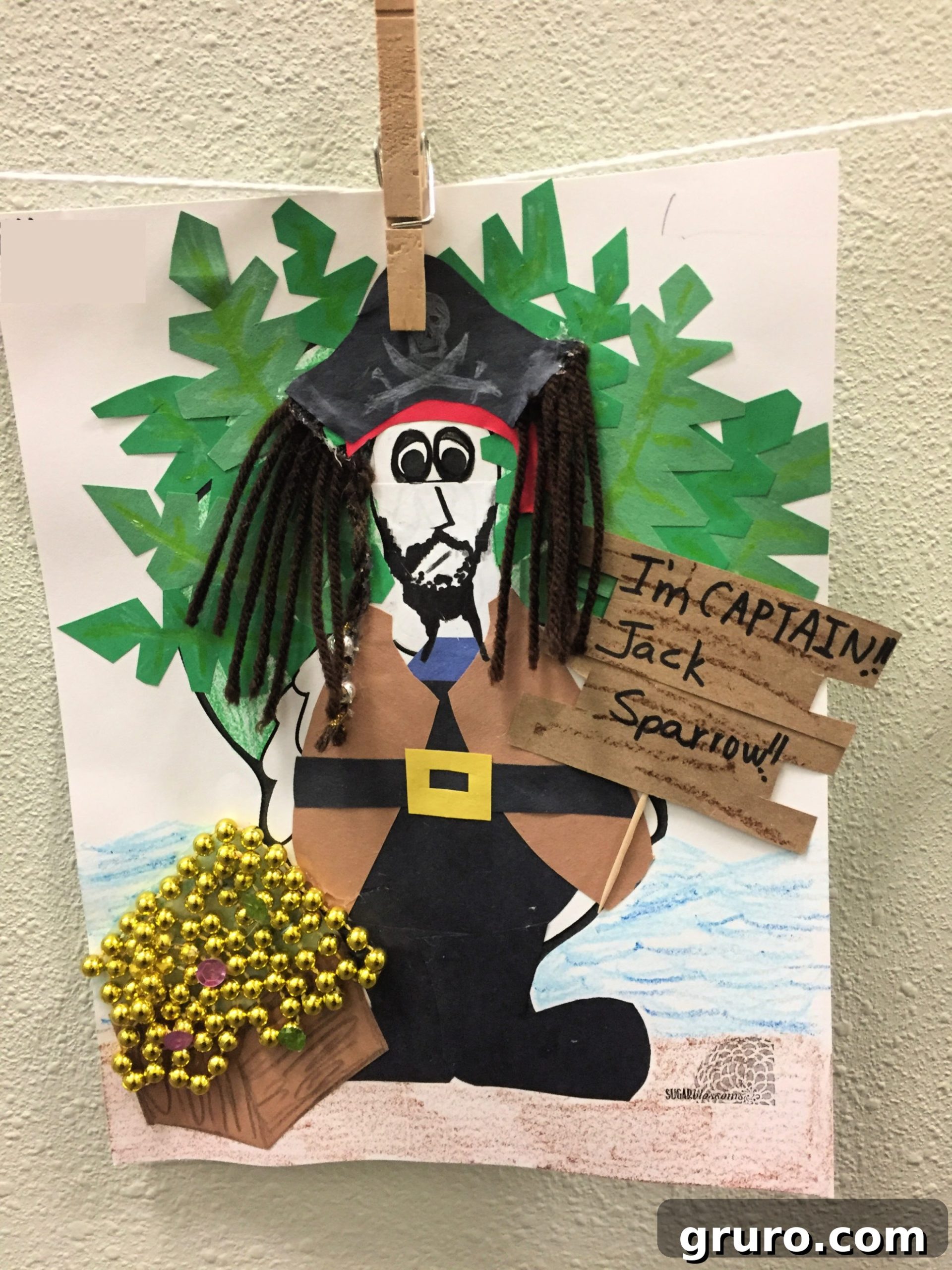 Paper Turkey In Disguise dressed as Jack Sparrow with yarn hair, construction paper clothing, and beads for treasure.
