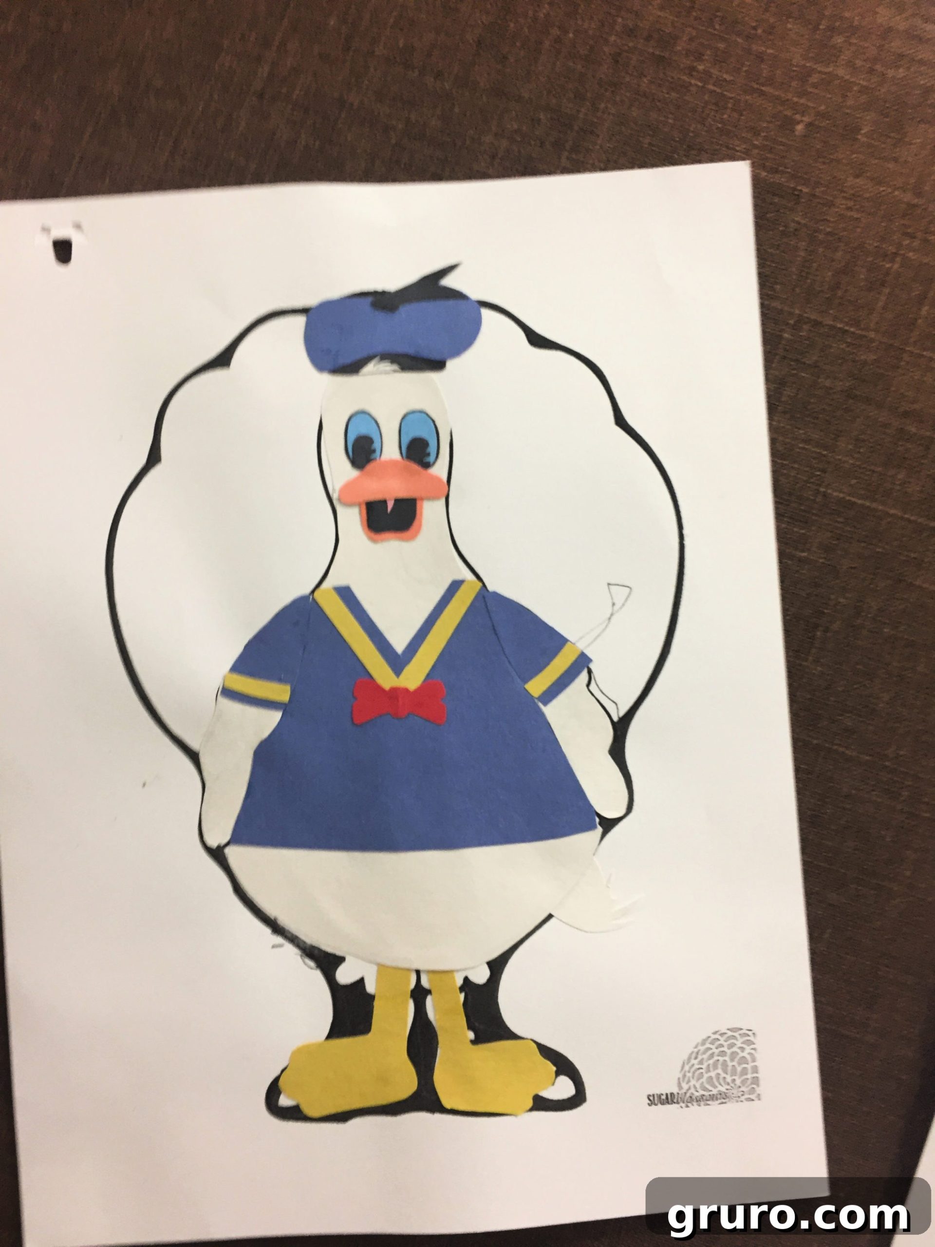 Paper Turkey In Disguise dressed as Donald Duck with construction paper clothing.