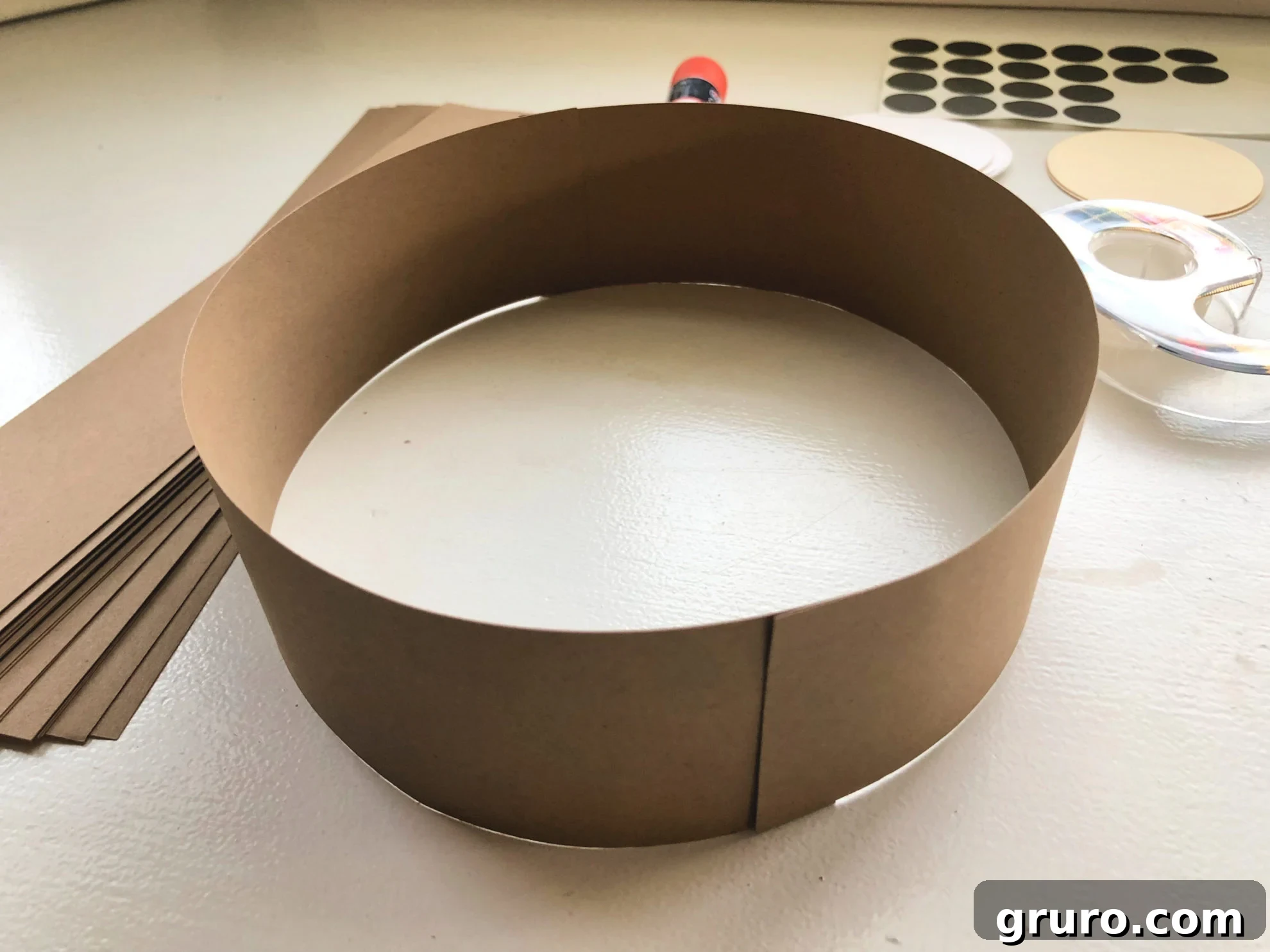 Two pieces of brown cardstock taped together to make a circular headband.