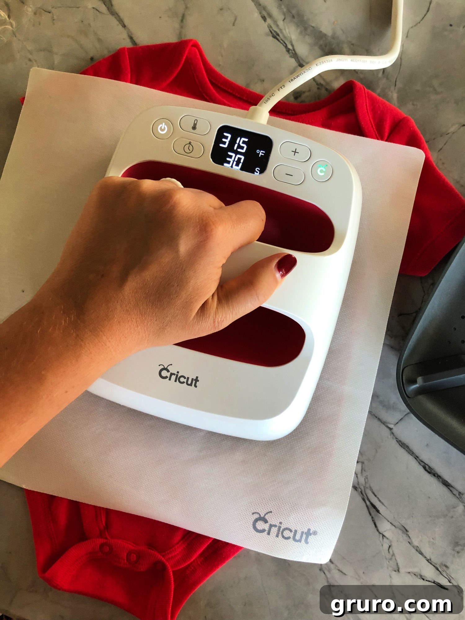 Cricut EasyPress in action on Santa T-shirt