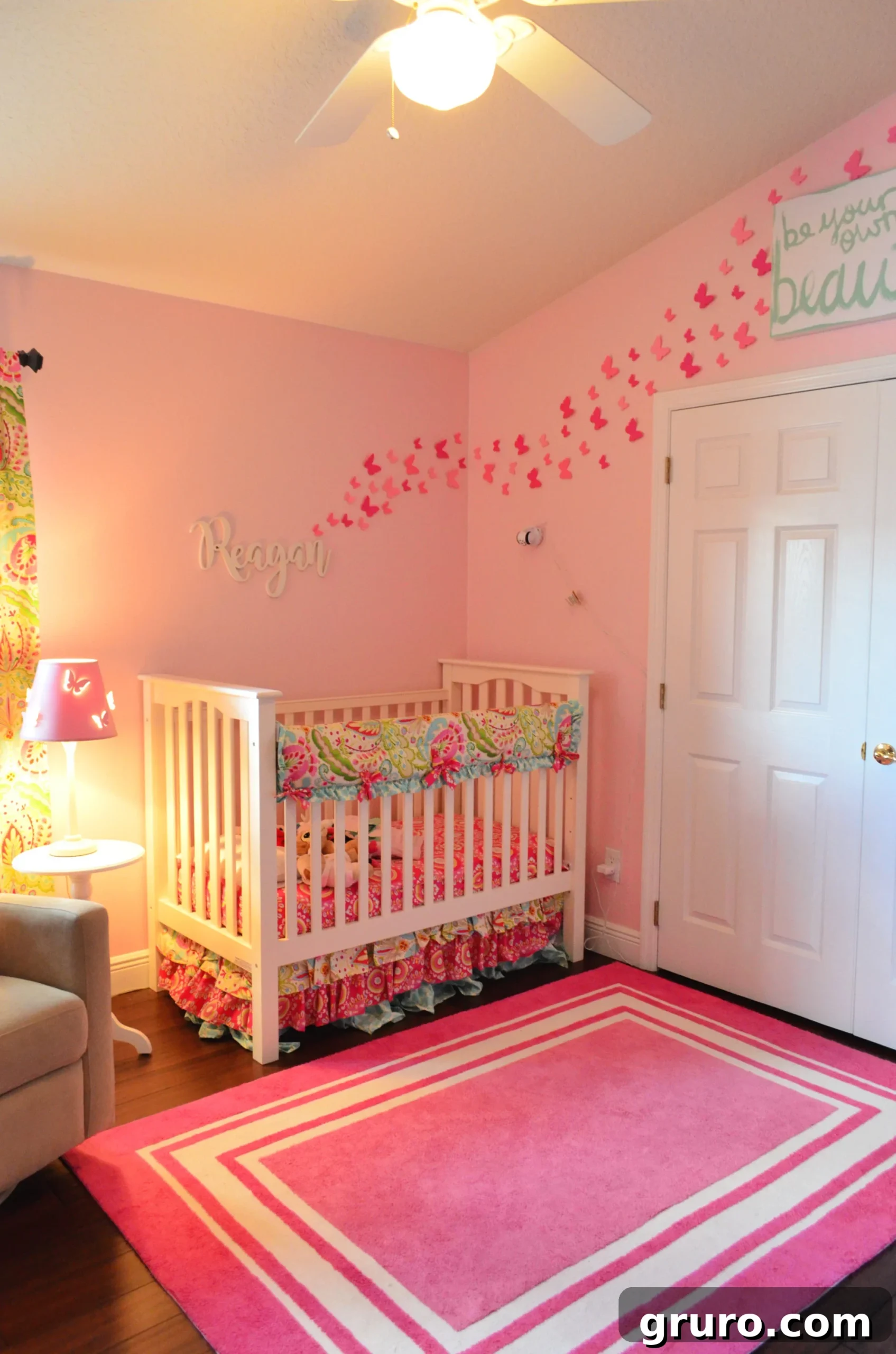 Baby Girl Floral Nursery with delicate paper butterflies on the wall