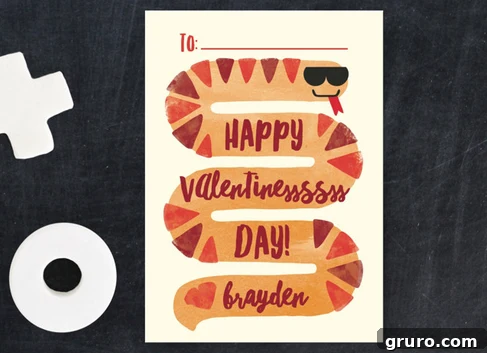 A snake on a card that says "happy valentinesssss day! love brayden"
