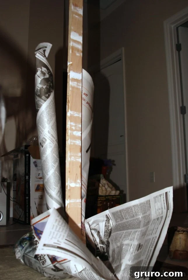 Long scrap wood used as the main support spine for the mummy