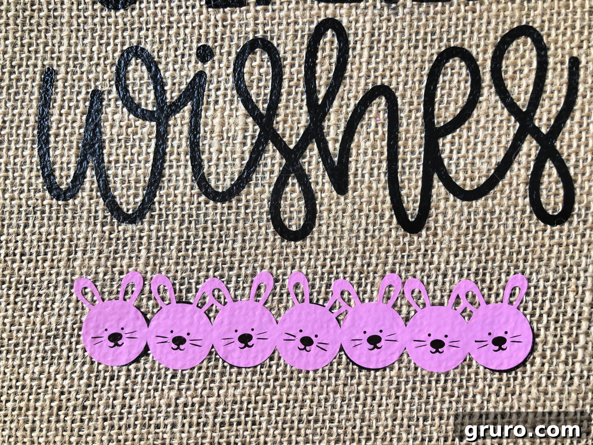 An example of a slight error in layering Iron-On Vinyl on a Bunny Kisses & Easter Wishes Burlap Garden Flag.