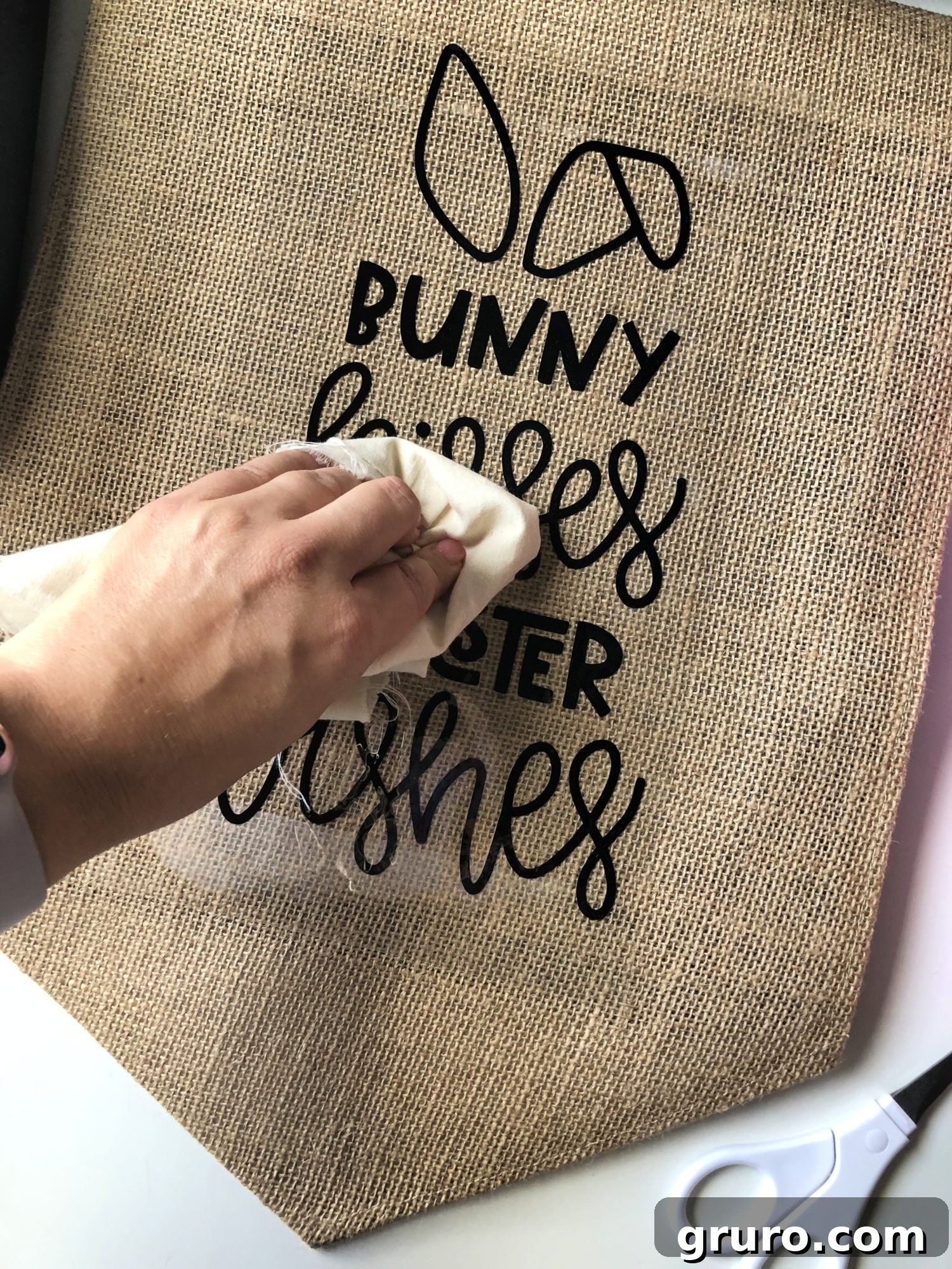 Close-up of the Bunny Kisses & Easter Wishes Burlap Garden Flag, highlighting tips for pressing burlap.
