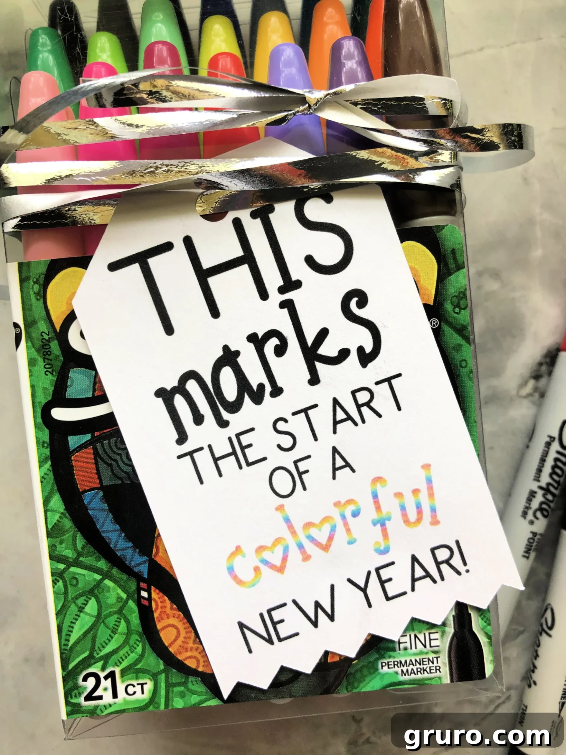 Close up of a sharpie bag with a tag that reads "This marks the start of a colorful new year"!