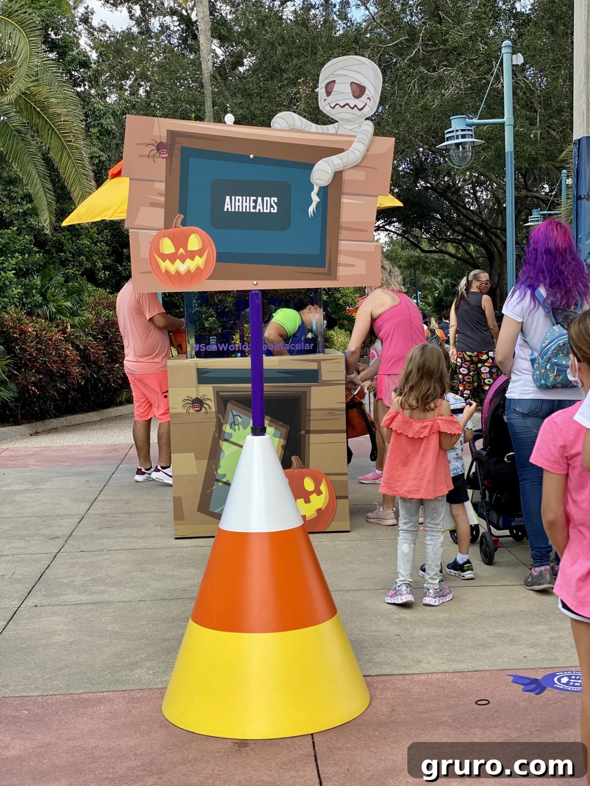 Candycorn large cone with sign that reads "airheads" at Trick or Treat station SeaWorld.