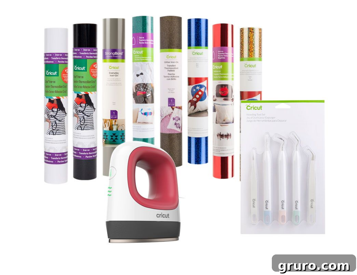 A vibrant Raspberry-colored EasyPress Mini with rolls of Cricut Iron-On Vinyl and a set of essential Cricut tools.