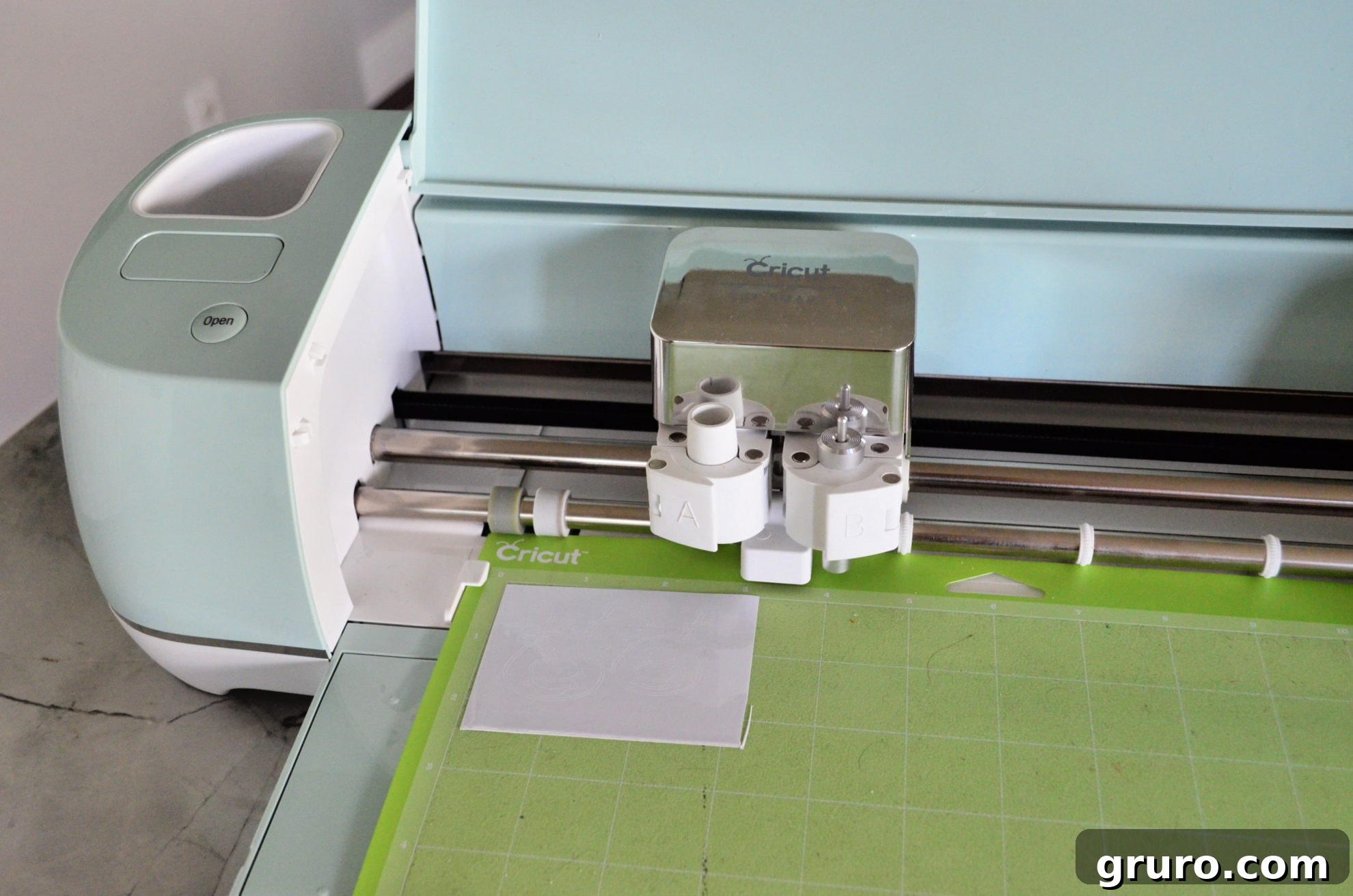 Cricut Explore Air 2 cutting white adhesive vinyl for Jingle Juice Glasses